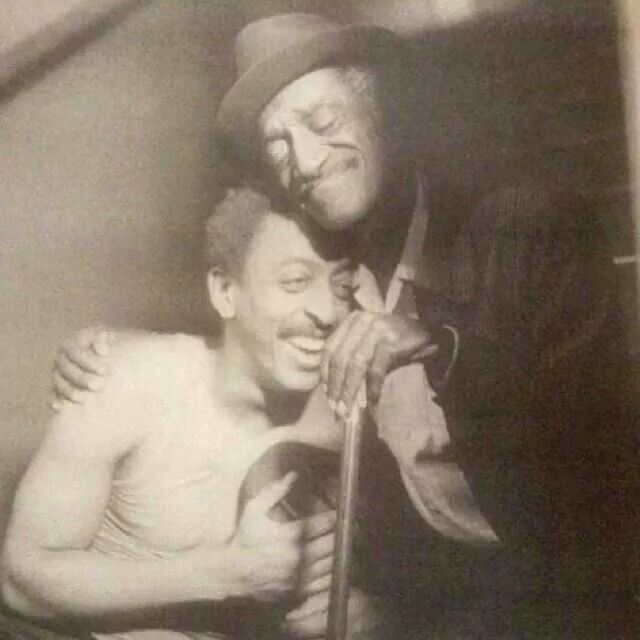 Gregory Hines and Sammy Davis, Jr smiling and embracing